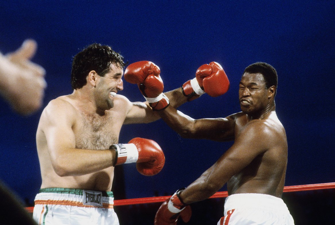 LAS VEGAS - JUNE 11,1982: Gerry Cooney (L) throws a punch against Larry Holmes during the fight at Caesars Palace, Outdoor Arena in Las Vegas, Nevada. Larry Holmes won the WBC heavyweight title by a TKO 13. (Photo by: The Ring Magazine/Getty Images)